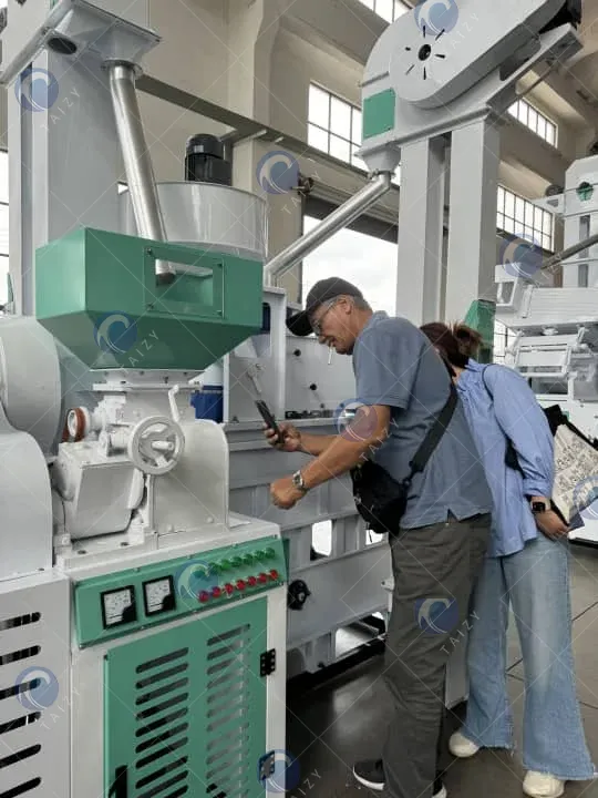 customers visit rice mill machine manufacturing plant
